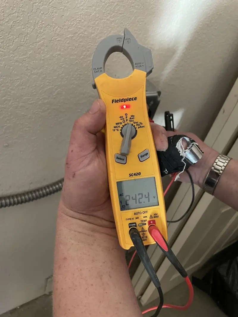 Voltage testing with clamp meter during Whole House Surge Protector in Charlestown
